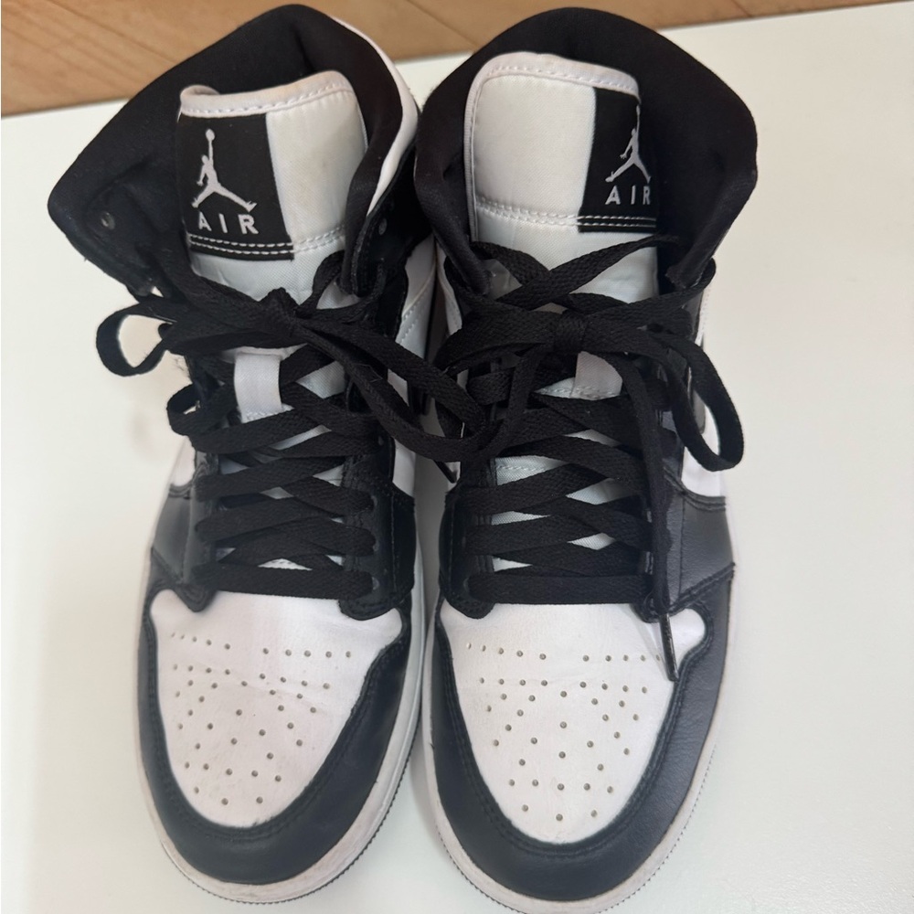 Nike Air Jordans black and white high top sneakers